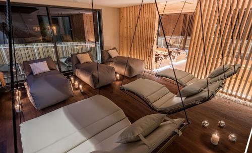 a living room with chairs and a swing at matill - timeless boutique retreat in Laces