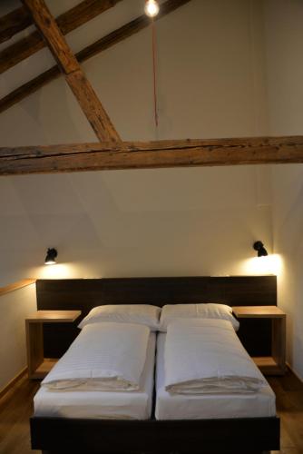 a bedroom with two beds in a room at Maison am Liesingbach in Vienna