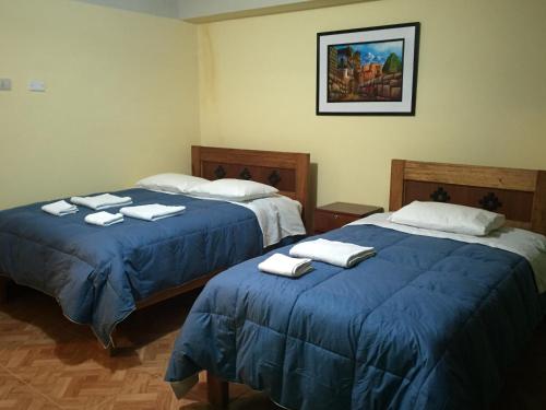 Postel nebo postele na pokoji v ubytování Rumi Sonqo Hostel