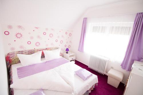 Postel nebo postele na pokoji v ubytování Margo Apartman