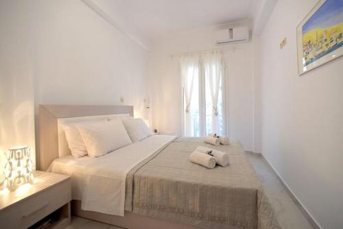 Säng eller sängar i ett rum på Elia Sea View Apartment