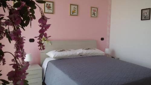 Ένα ή περισσότερα κρεβάτια σε δωμάτιο στο B&B A casa di Eleonora