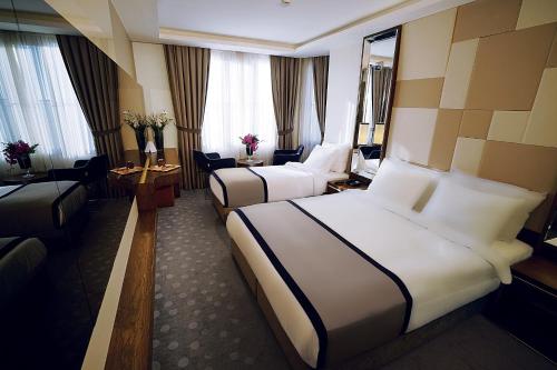 Postel nebo postele na pokoji v ubytování The Biancho Hotel Pera