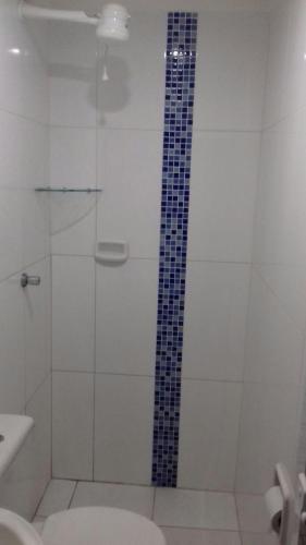 a bathroom with a shower with a glass door at Hotel Michel in São Paulo