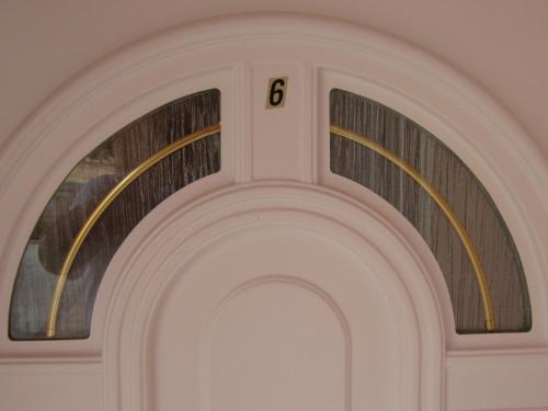 an archway with the number on it at Apartments Stengl in Rab