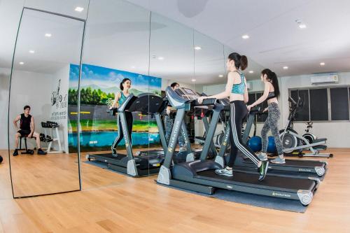 a group of people exercising on treadmills in a gym at The Peak in Chanthaburi