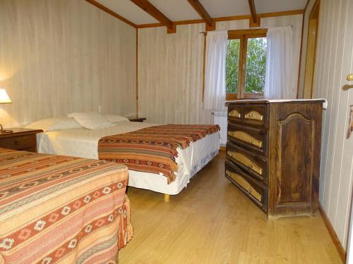 Una cama o camas en una habitación de Hostel de Las Manos