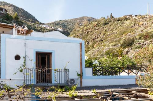 a white house on the side of a mountain at La Casa del Pescatore in Filicudi