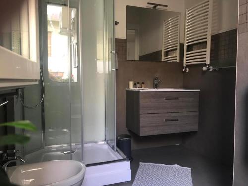 a bathroom with a shower and a toilet and a sink at B&B Paradiso Relais in Messina