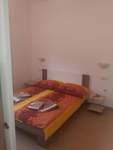 Ένα ή περισσότερα κρεβάτια σε δωμάτιο στο Apartmani B&B