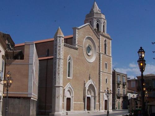 a large church with a clock tower on a building at la casa di asmei b & b Lucera in Lucera