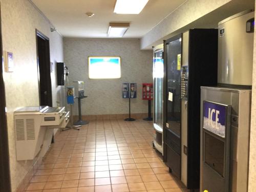 a hallway of a hospital with a cashierasteryasteryasteryasteryasteryasteryastery at Americas Best Value Inn and Suites Saint Charles in St. Charles
