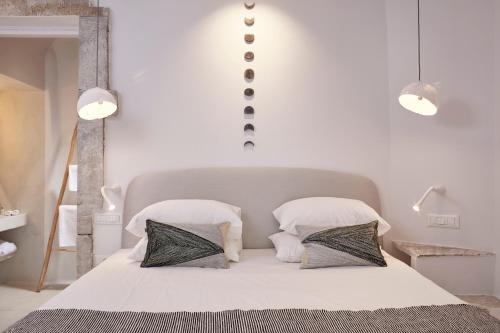 Cama o camas de una habitación en Cosmopolitan Suites - Small Luxury Hotels of the World