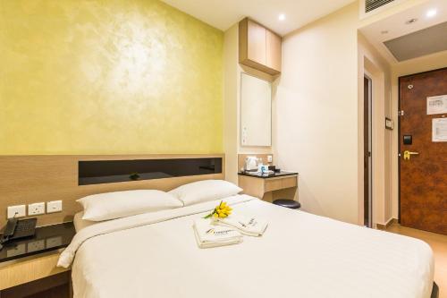 Postel nebo postele na pokoji v ubytování Fragrance Hotel - Ocean View