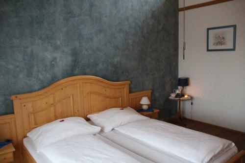 a bed with two white pillows in a bedroom at Weingut Schatz in Heimschuh