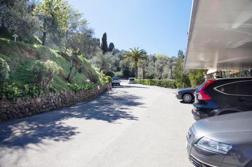 a street with cars parked on the side of the road at Doria Park Hotel in Lerici