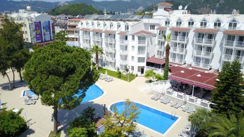 an aerial view of a resort with a pool and buildings at Halıcı Hotel Marmaris in Marmaris