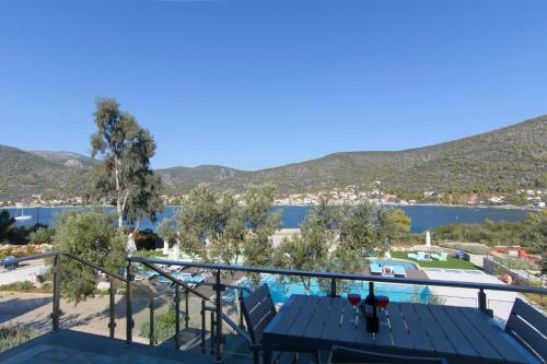 a view of the water from the balcony of a house at Lavender Cove in Korfos