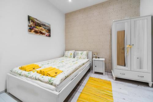 Posteľ alebo postele v izbe v ubytovaní Dominika Apartment