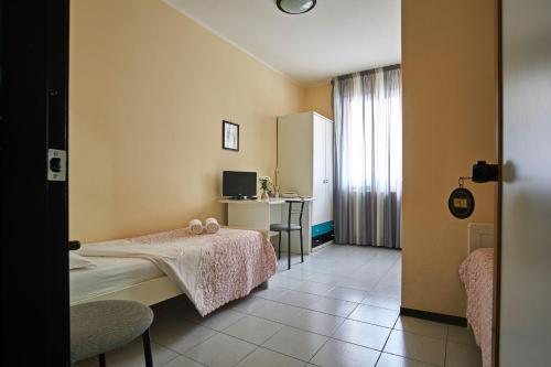Postel nebo postele na pokoji v ubytování Hotel Mazzurco