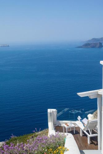 a view of the ocean from a house at Athermi Suites - Adults Only in Megalokhori