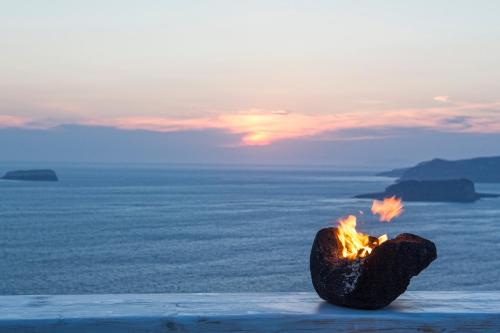 a piece of food sitting on top of the ocean at Athermi Suites - Adults Only in Megalokhori