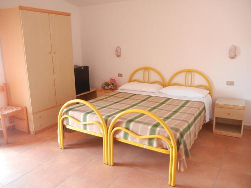 Tempat tidur dalam kamar di Albergo Il Brillantino
