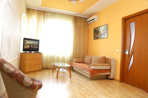 a living room with a couch and a table at Apartment.md in Chişinău