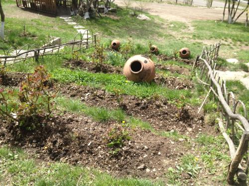 a garden with three large pipes in the grass at Old Halidzor in Halidzor