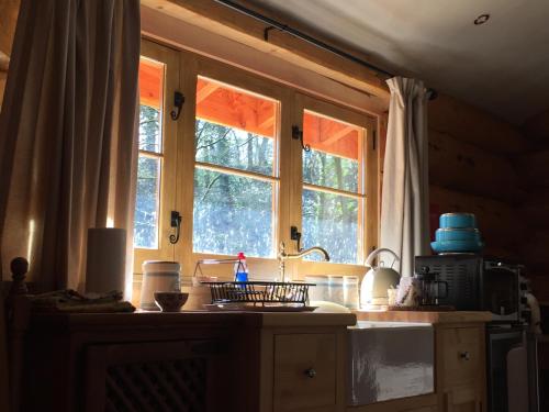 a kitchen with a sink and a window at Hesperus Lodge in Wellington
