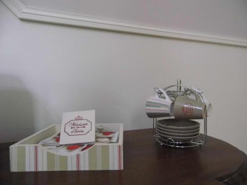 a table with a hello kitty machine and a box at Moulin d'Amour in Chambon