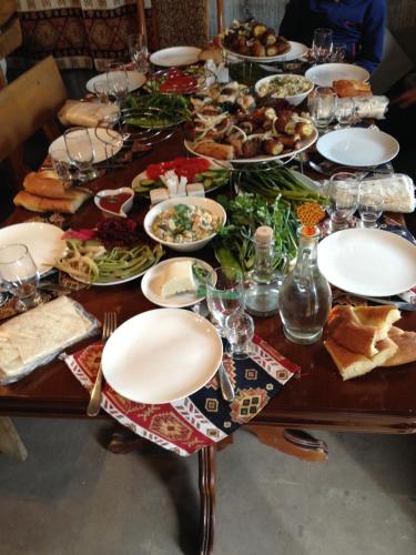 a table filled with plates of food on top at Old Halidzor in Halidzor