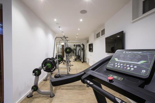 a room with a gym with a treadmill at TWO Hotel Berlin by Axel - Adults Only in Berlin