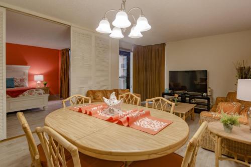 a dining room with a table and a living room at Sea Vista in South Padre Island