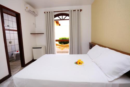 En eller flere senger på et rom på Andimar Hotel