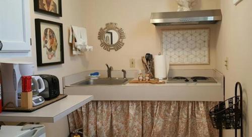 a kitchen with a sink and a counter top at Starlight Lodge Cape Cod in Dennis