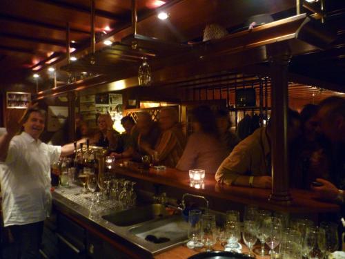 a group of people sitting at a bar at Heidehotel Herrenbrücke in Faßberg