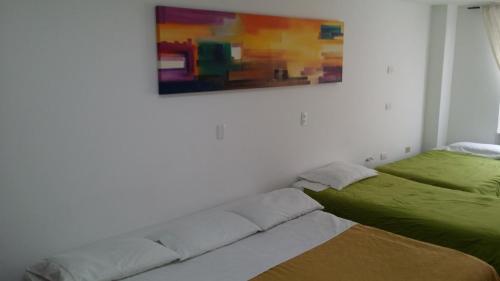 Postel nebo postele na pokoji v ubytování A Bogota On Holidays by Open - HOTEL CAS-EMBAJADA AMERICANA