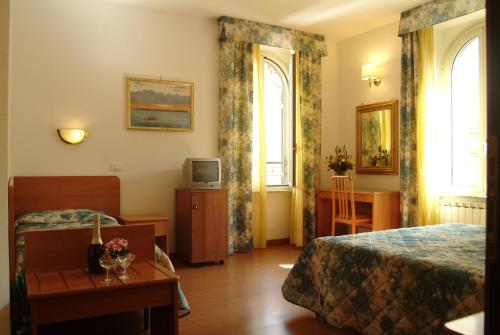 Posteľ alebo postele v izbe v ubytovaní Hotel Tirreno