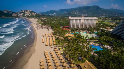 an aerial view of the beach at a resort at Princess Mundo Imperial Riviera Diamante Acapulco in Acapulco