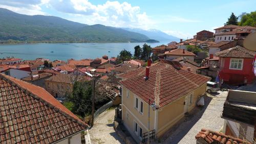 a view of a town with a lake and buildings at Apartment and Studio Damjan in Ohrid