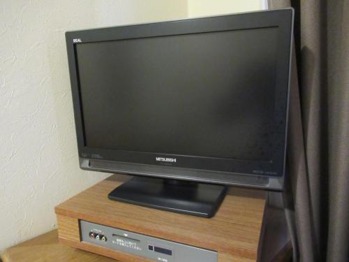 a flat screen tv sitting on top of a table at Hotel Crown Hills Kumamoto in Kumamoto