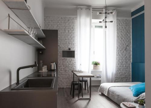 Kuchyňa alebo kuchynka v ubytovaní Cà Bèla - Lambrate Flat 1