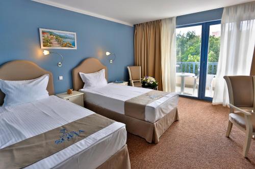 Postel nebo postele na pokoji v ubytování Sofia Hotel - All Inclusive & Private Beach