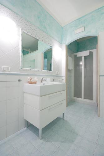 a bathroom with a sink and a mirror at Casale Sant'Angelo in Capalbio