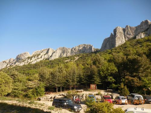 a parking lot in front of a mountain at Les Cigales du Ventoux in Le Barroux