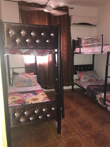 a bedroom with two bunk beds in a room at Sami Hostel in Jericho