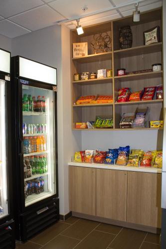 a store with an open refrigerator with food inside at Microtel Inn & Suites by Wyndham - Penn Yan in Penn Yan