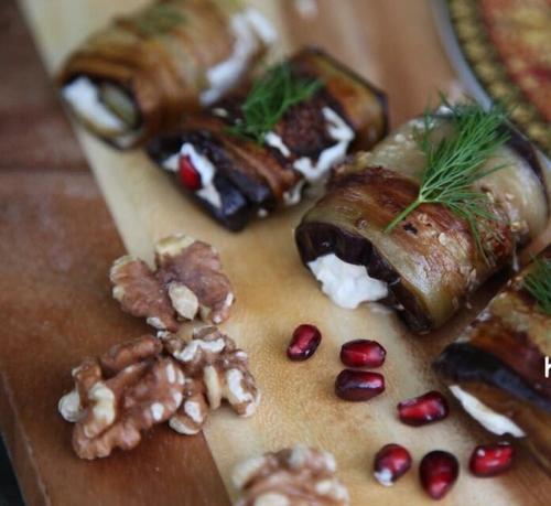 a table with some food on a cutting board at Areguni Guest House in Dilijan