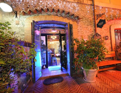 an open door to a building with potted plants at B&B Pontepiccolo in Catanzaro